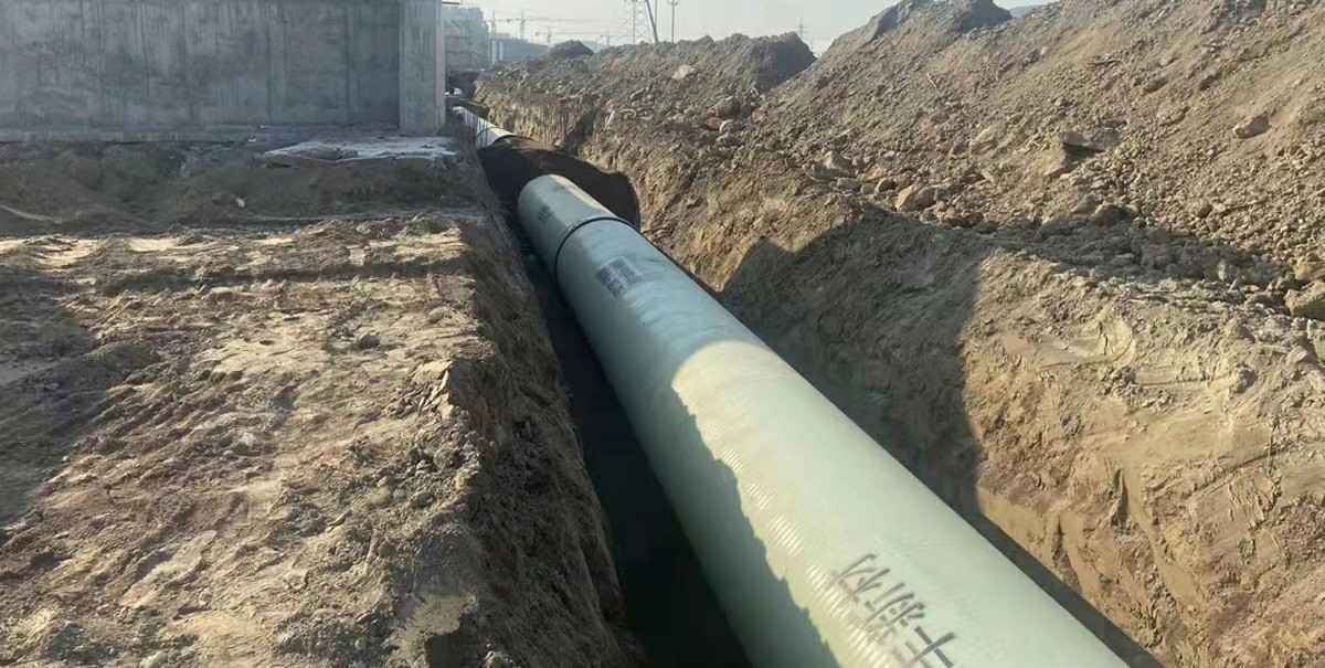 Fibergalss Reinforced Plastic pipe under installation Fibergalss Reinforced Plastic pipe under installation